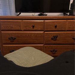 Television With A Firestick And A Dresser