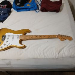  Squier Stratocaster electric guitar in an Aztec Gold finish. 