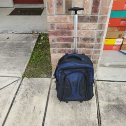 Blue Backpack With Wheels And A Handle 
