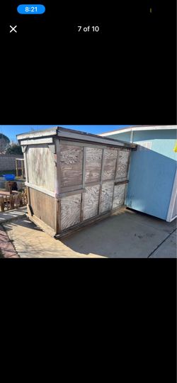 Outdoor shed with wheels and roof