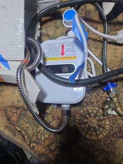 Portable thankless water heater for shower, grat for camping, or back yard pool shower, brand new. Never used, just plug in water, plug in power. And 