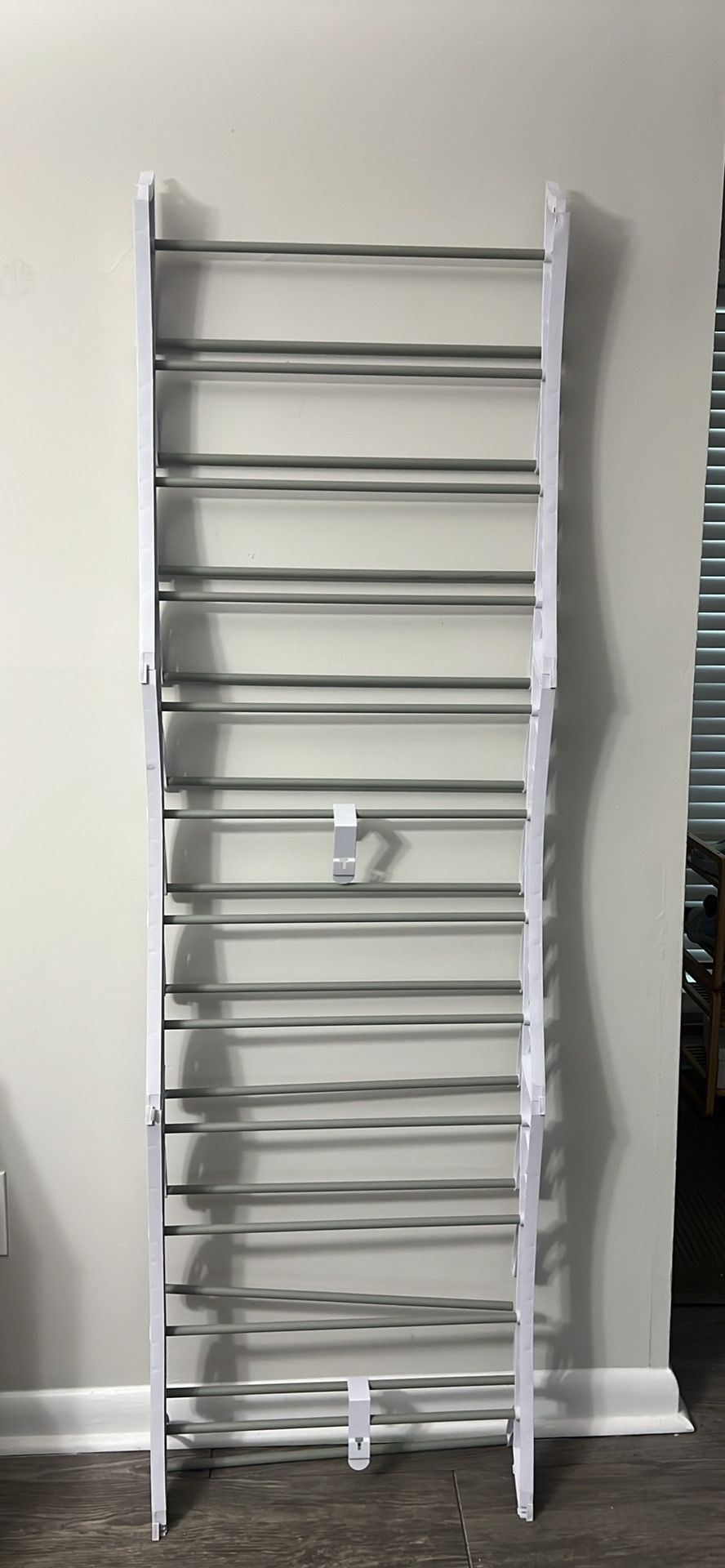 Shoe stand hangs on door