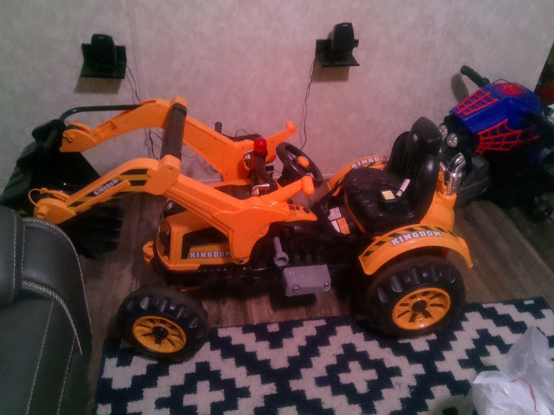 Two Aosom items: 6v kids Ride on toy Grave Digger Toy Truck Construction Excavator Tractor Vehicle, Yellow/Black and 6v Spiderman Motorcycle, Battery