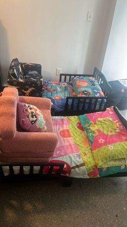 2 Kids beds with chairs and pillows