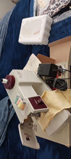 Maquina de coser portable