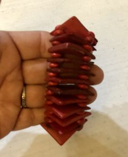 New! Neat red wooden bracelet. Very unique! Bracelet is stretchy.l