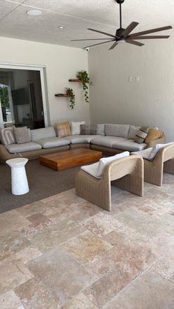 Outdoor sofa set with two chairs.
