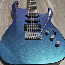 Electric Guitar, Camaleon Color Changing Top, Blue Stained Sides And Back. New Strings . Comes With Gig Bag.