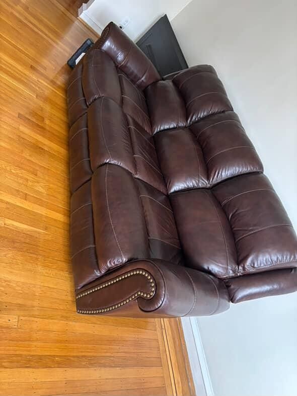 (Free Delivery) Brown leather dual reclining sofa