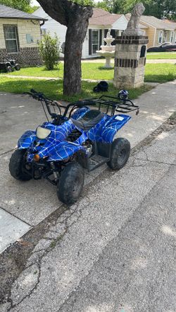 Blue fourwheeler good for a 9-10 year old