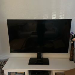 TLC 4K Smart TV with Premium Stand 
