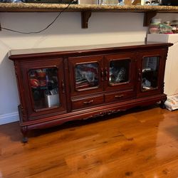 Wood display cabinet with glass doors and drawers