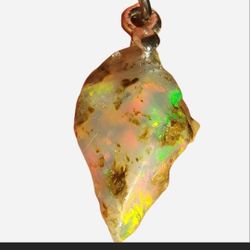 Stunning Natural Opal Pendant - New - 17mm - Very Flashy Rainbow Inclusions

Natural Ethiopian Fire Opal Rough Untreated Crystal Pendant Unique Jewelr