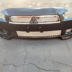 2008-2015 Mitsubishi Lancer Front Bumper With Grill And Emblem And Fog Lights With Accessories And Lower Lips Oem