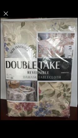 Brand new Double take reversible damask tablecloth and matching reversible 8pcs placemat sets.