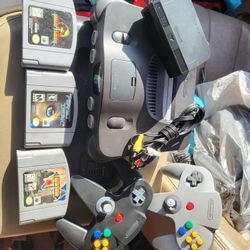 Nintendo 64 console with Castlevania, perfect dark, mortal kombat 4, 2 controllers and cords.