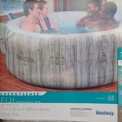 4-person, 120 Jet Inflatable Hot Tub. Includes cover, pump, and 2 Filter Cartridges