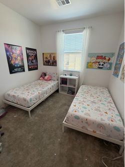 Twin beds with mattresses