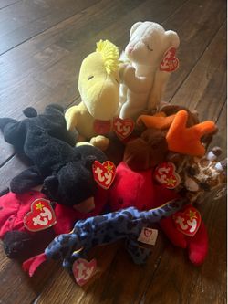 8 ty beanie babies. With tags