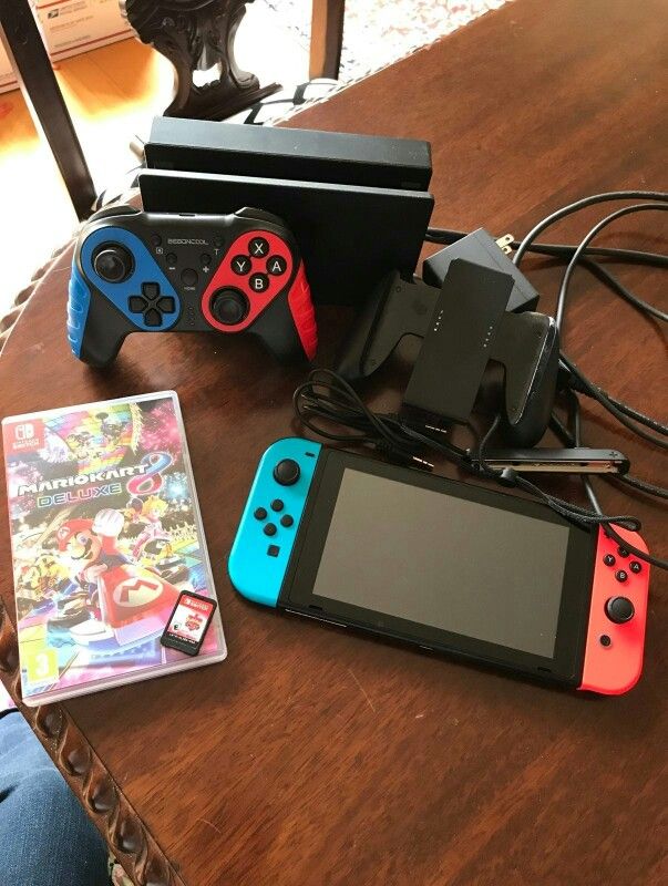Nintendo Switch plus two games and extra