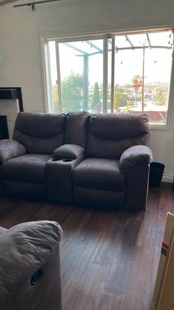 Brown leather couch and loveseat recliners