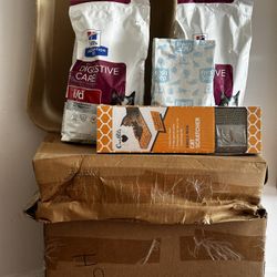 Package Of Special Cat Food, Disposable Litter Boxes And Sand