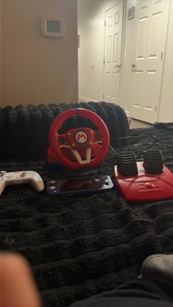 Nitendo with controller and steering wheel&pedals comes with charger no dock
