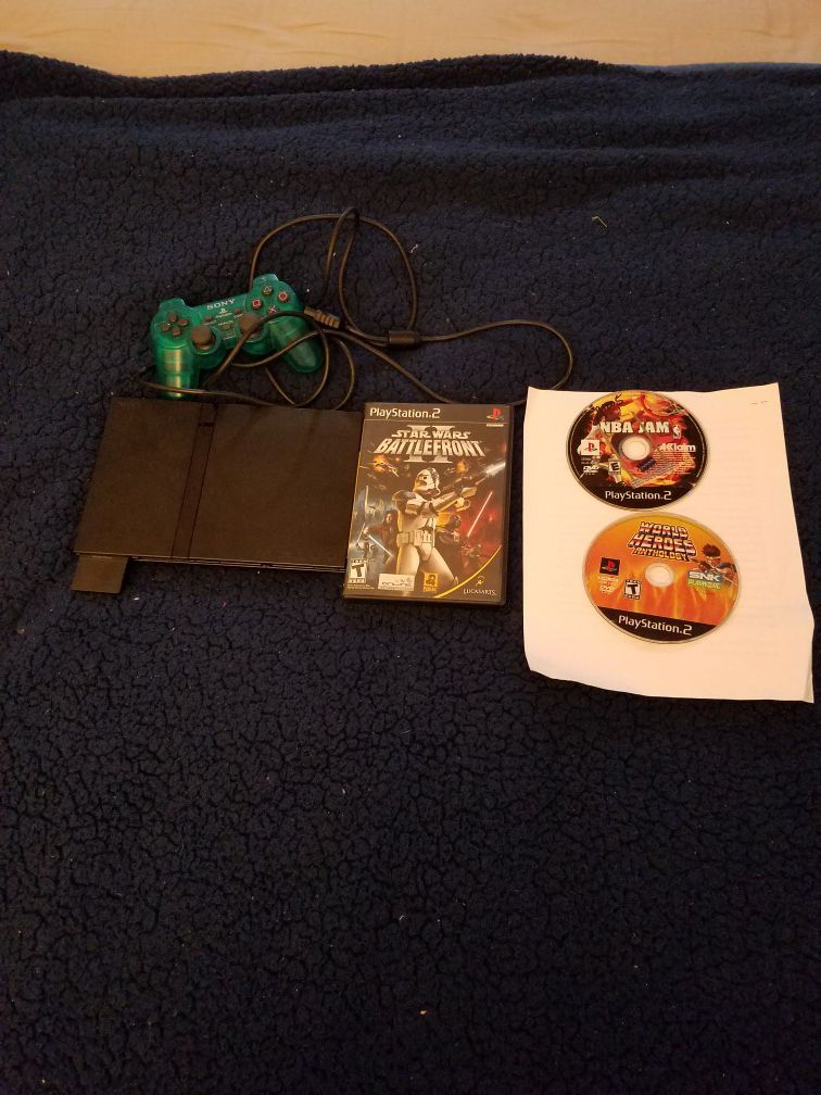 Ps2 slim with 2 controllers and 4 games