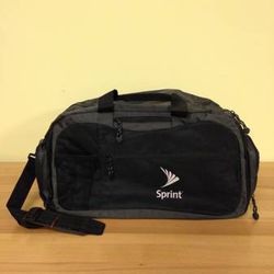 New! Black Duffel bag. Soft sided, flexible carry bag with strap.

