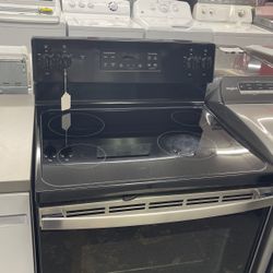 Used GE 4 Burner Glass Top Black And Stainless Steel Range. 1 Year Warranty 