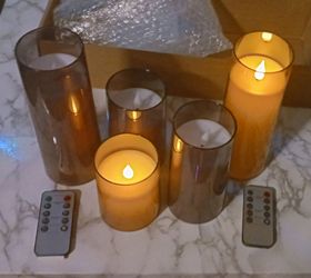 Flameless candle in smoked color containers have remote