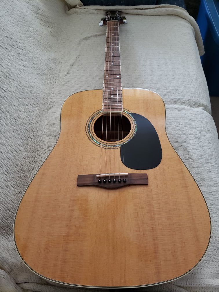 Like new, acoustic guitar by Mitchell. Model #MD100. Has been well taken care of since new and was always in a hard case.
