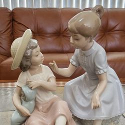 NAO By Lladró Porcelain Figurine - Girls Holding Baby