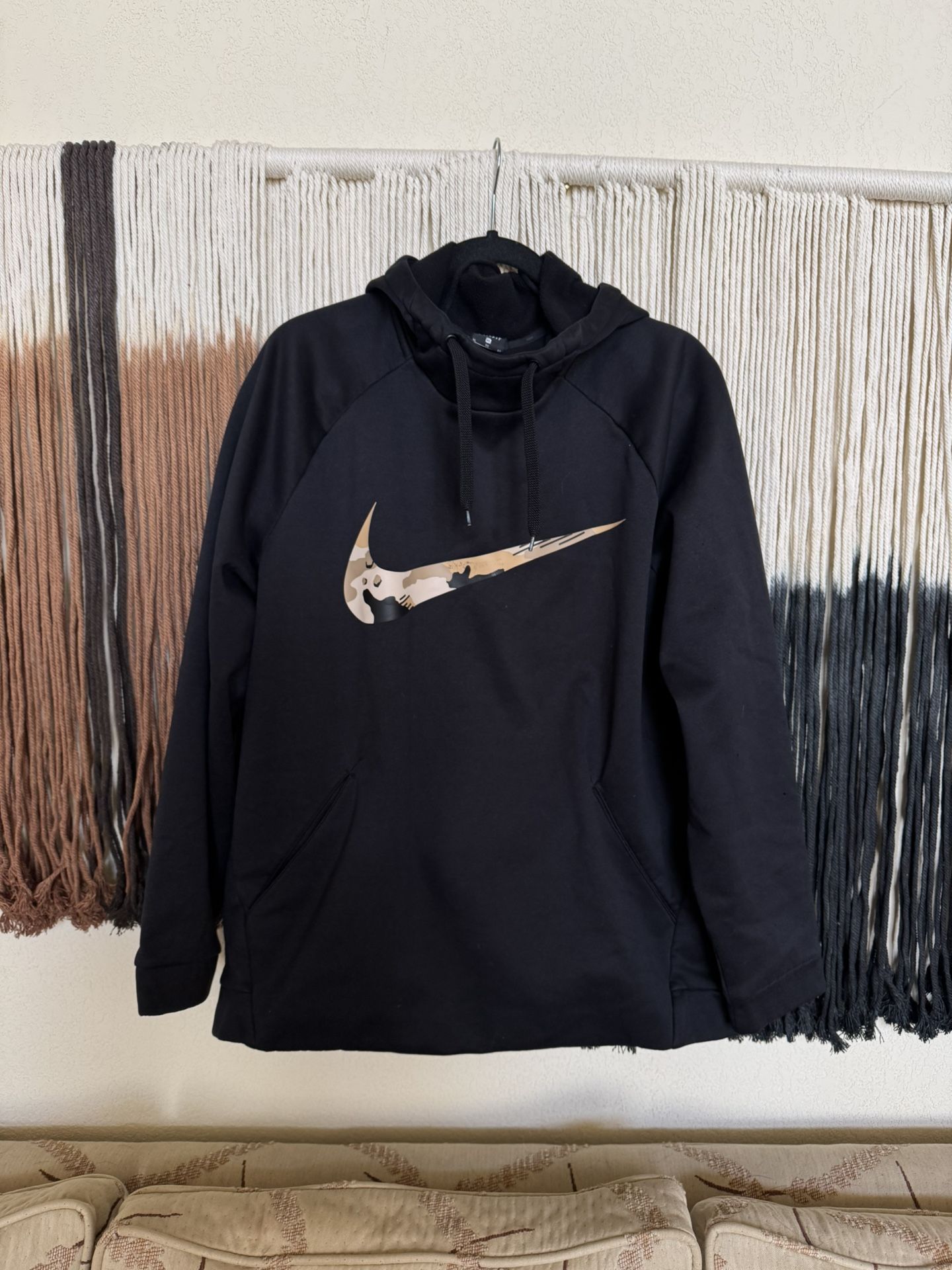 Black Nike hoodie with a tan camo logo; perfect condition