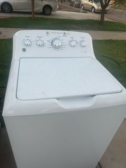 GE Top Load Washing Machine working great. 50$ delivery 30 day warranty