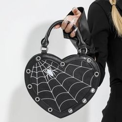 Heart shaped faux leather handbag with spider web detail print