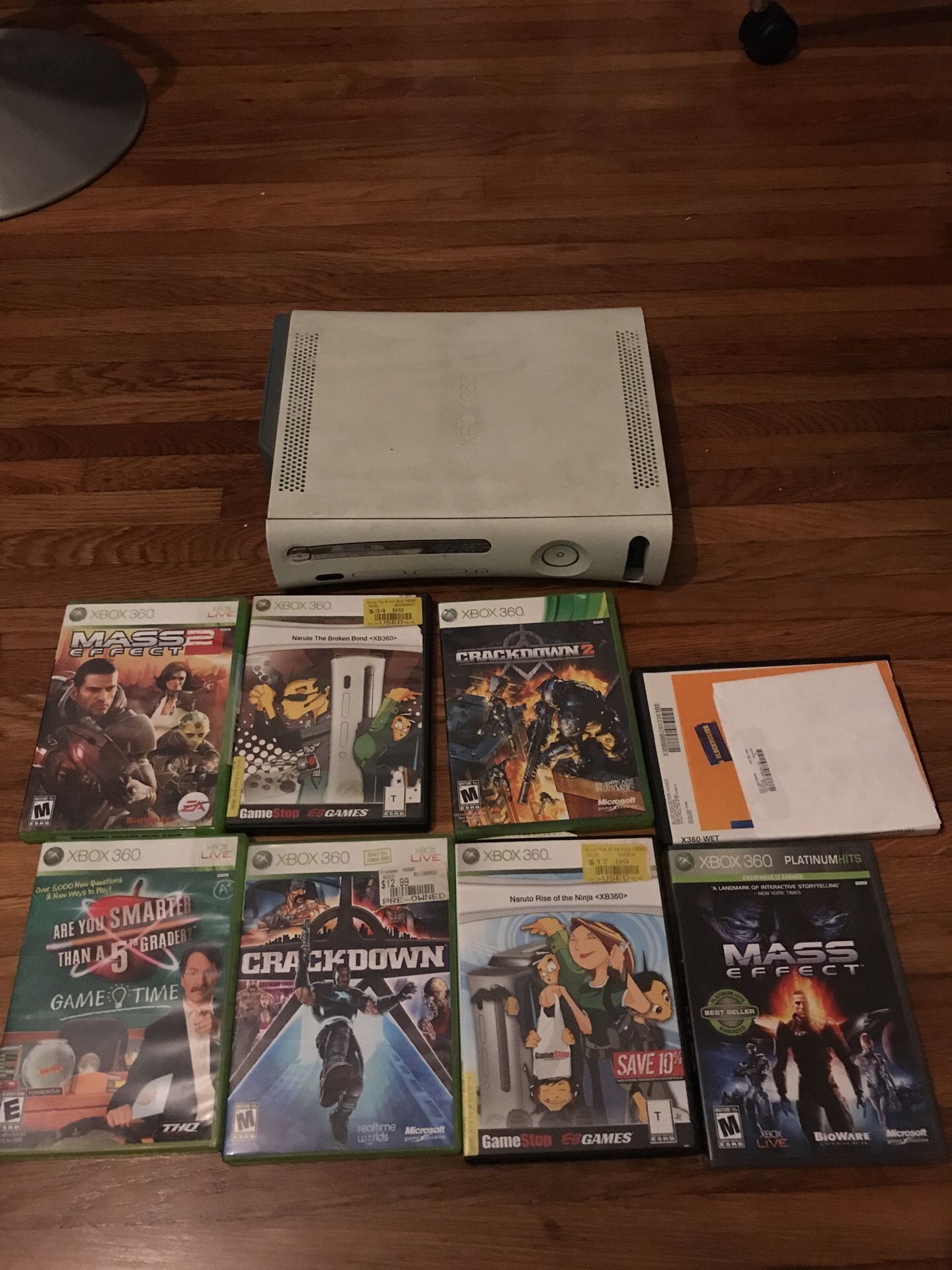Xbox 360 with 8 games. No cables or controllers