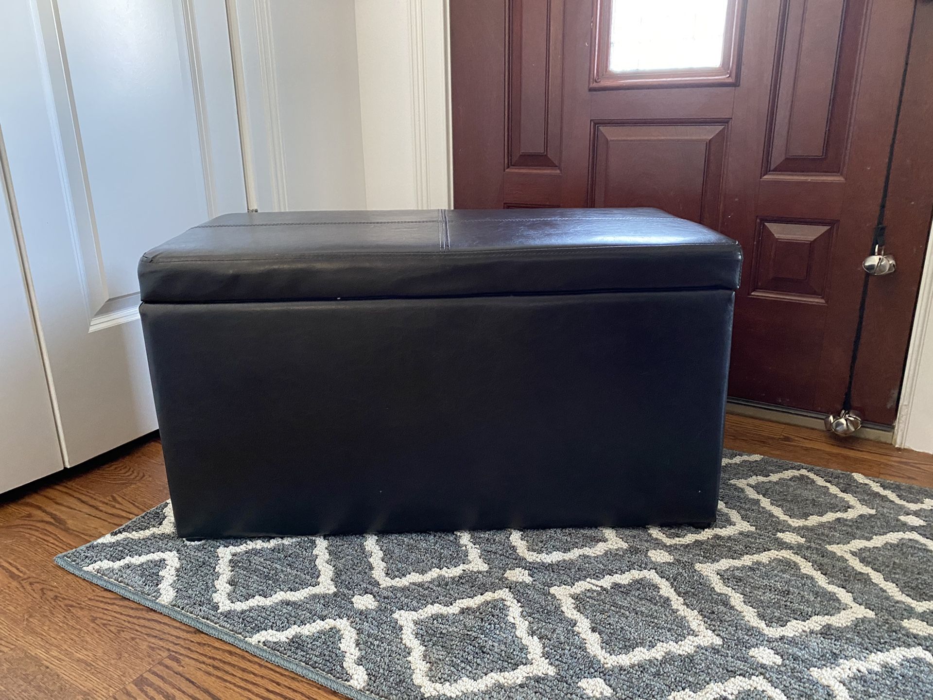 Black leather ottoman