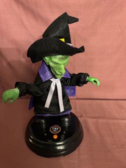GEMMY Halloween Animated Grave Raver Witch Plays Gim