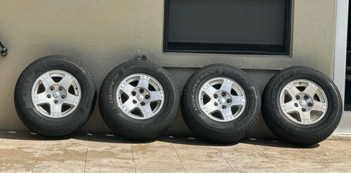 265 70 R17 Cooper Discoverer SRX Tires (all 4 tires and rims)
