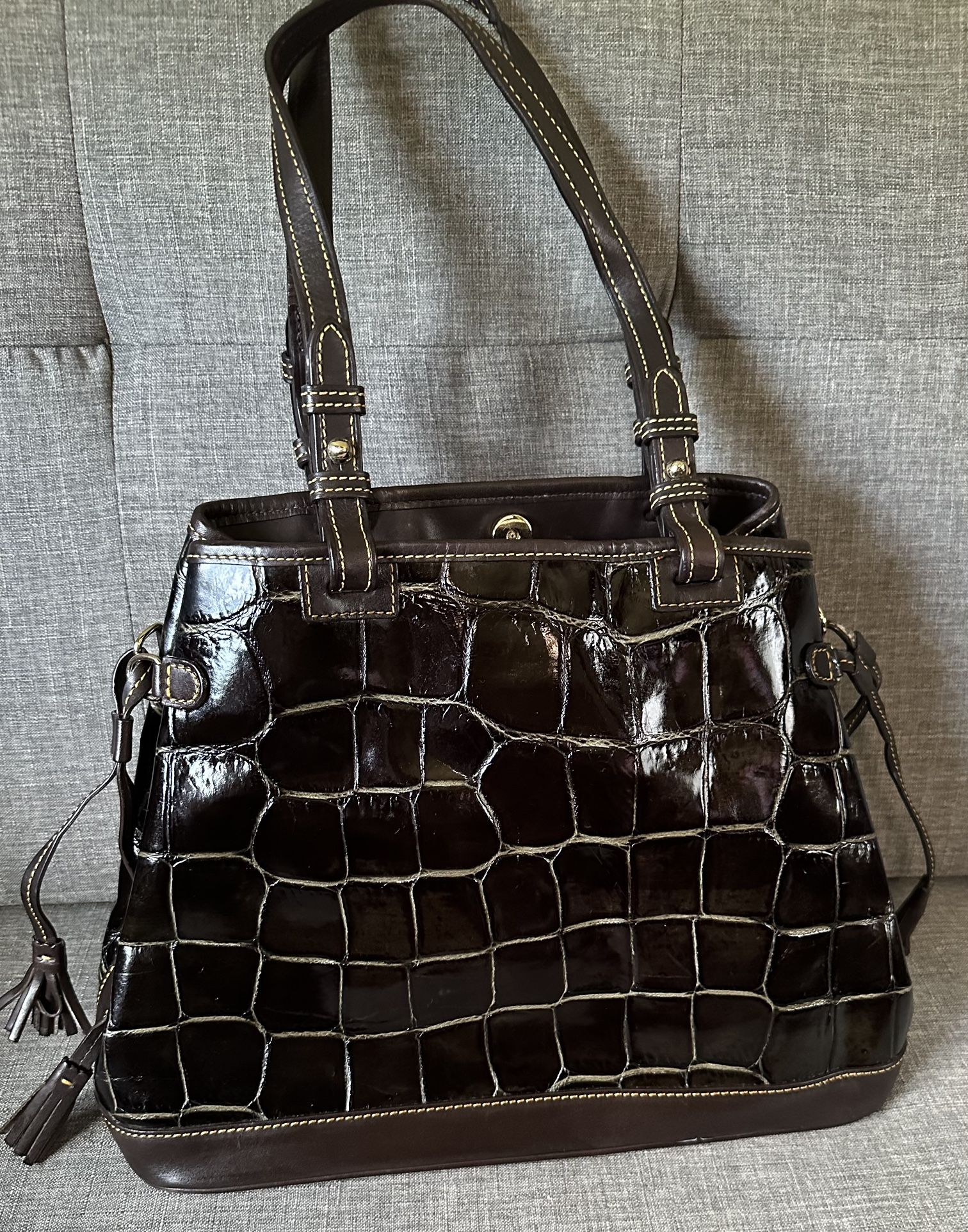Dark brown Dooney & Bourke with coin purse and key fob. Authentic