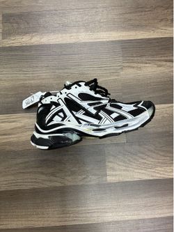 Balenciagas black and white sneakers