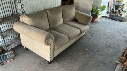Couch has a broken foot and a little dirty