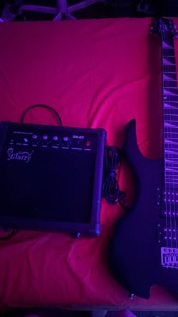 Black Electric Guitar with Amp and Cable