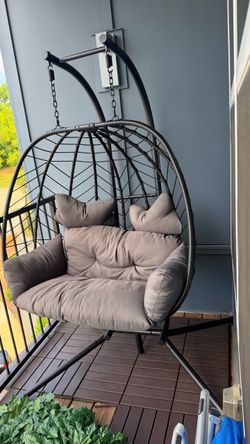 Two seat swinging egg chair