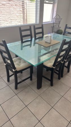 Dining table with chairs and a side table