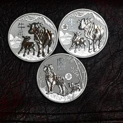 1oz .999 Silver Year Of The Ox & Year Of The Tiger Silver Coins