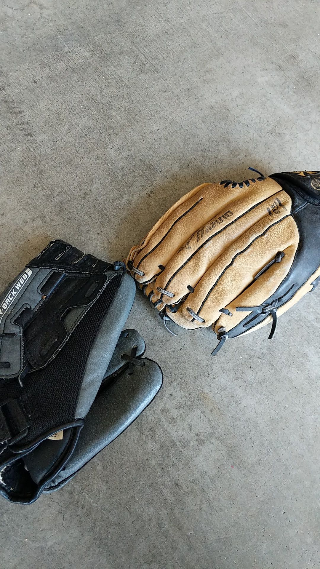 Two children baseball gloves