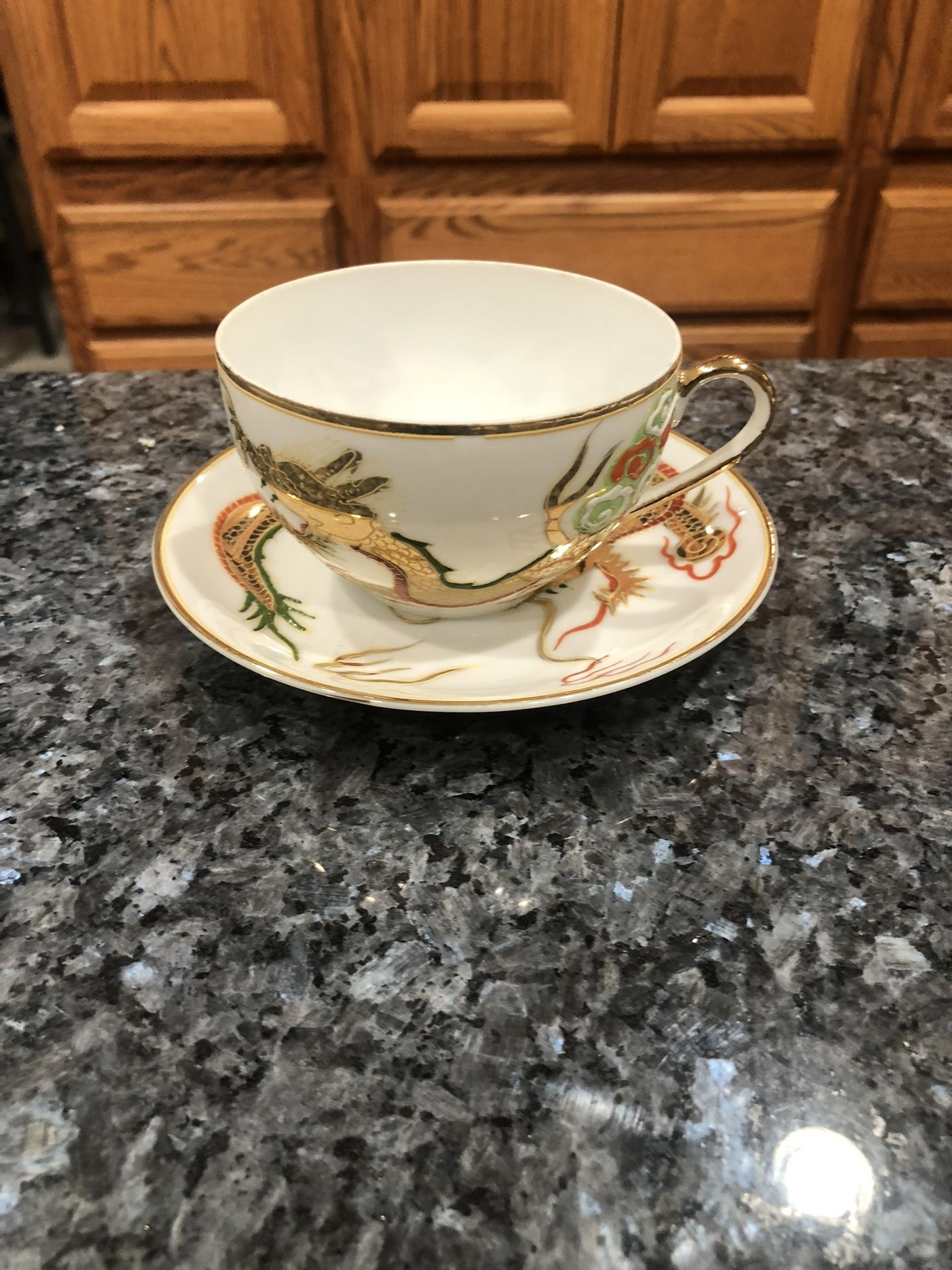 Cup & Saucer Set. Preowned Excellent Condition No Cracks Or Chips . Size saucer 5 inches wide and cup 2 1/2 inches by 2 1/2 inches. Has been on dis