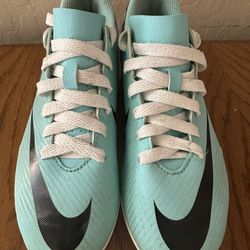Nike soccer cleats, youth size 4.5Y. Excellent condition, worn only a few times. Bright aqua and purple color with white laces. Clean and ready to wea